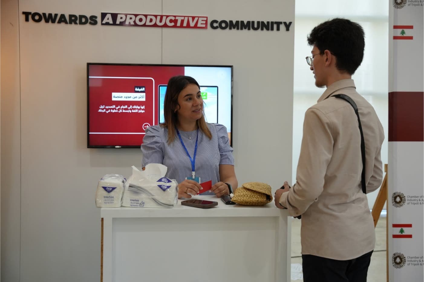 Visitors at a Jadwa06 booth at an entrepreneurship exhibition
